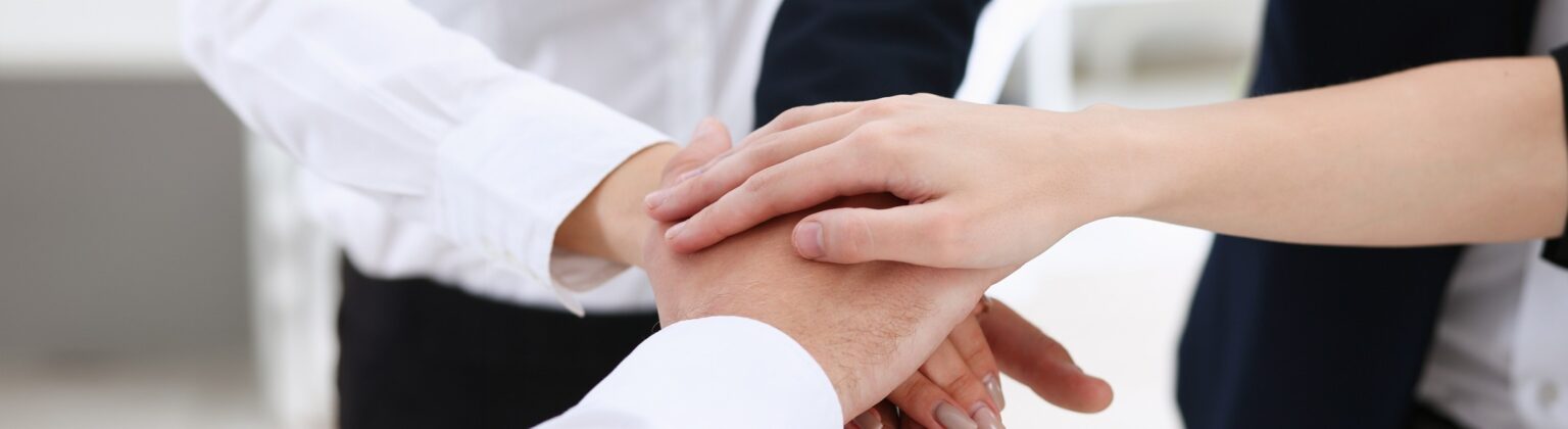 People in Team with Hands Crossed